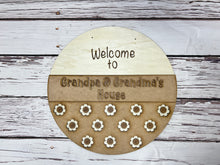 Load image into Gallery viewer, Welcome to Grandpa & Grandma’s house 16” Round flower Doorhanger