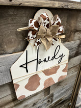 Load image into Gallery viewer, Howdy Welcome Cowprint Tag Doorhanger