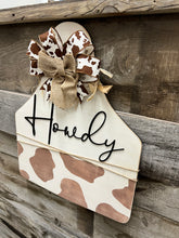Load image into Gallery viewer, Howdy Welcome Cowprint Tag Doorhanger