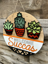 Load image into Gallery viewer, Welcome Succas 16” Round Doorhanger
