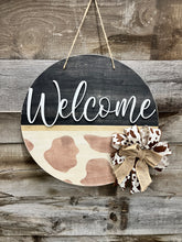 Load image into Gallery viewer, 16” Welcome Cowprint Round Doorhanger
